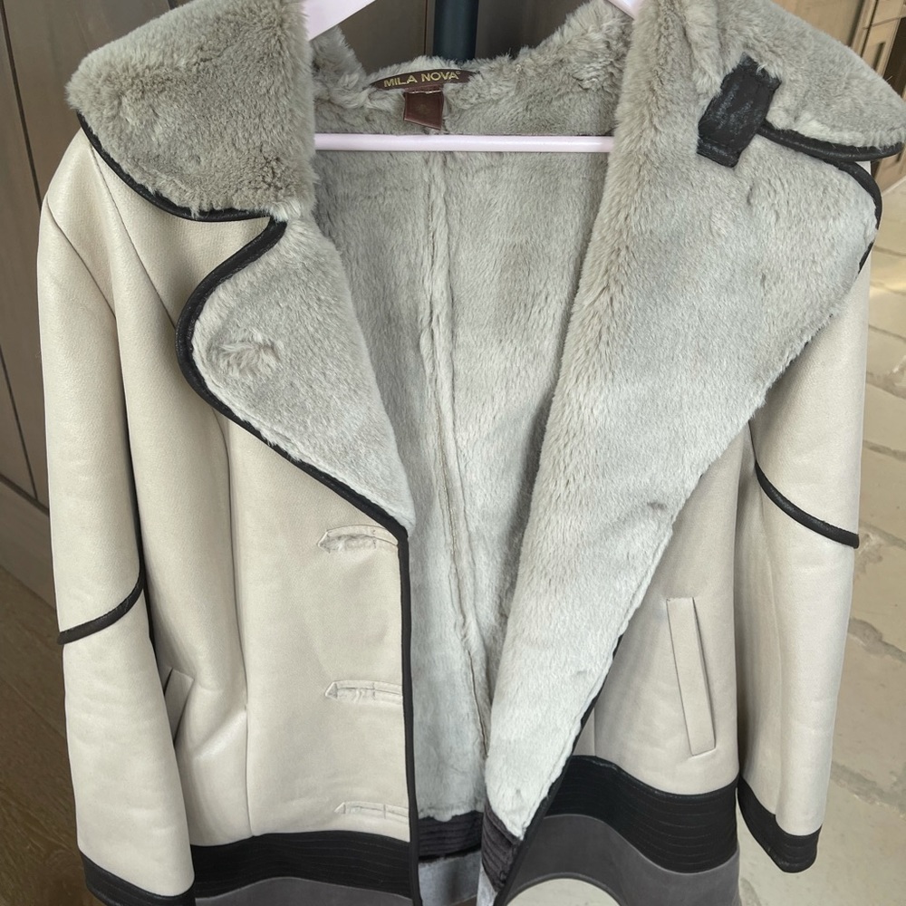 Jacket tan with some darker brown outside and gray inside